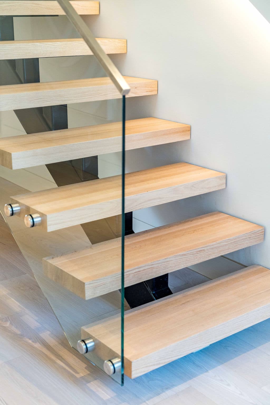 Cronulla project — floating staircase with oak treads and glass balustrade, view
