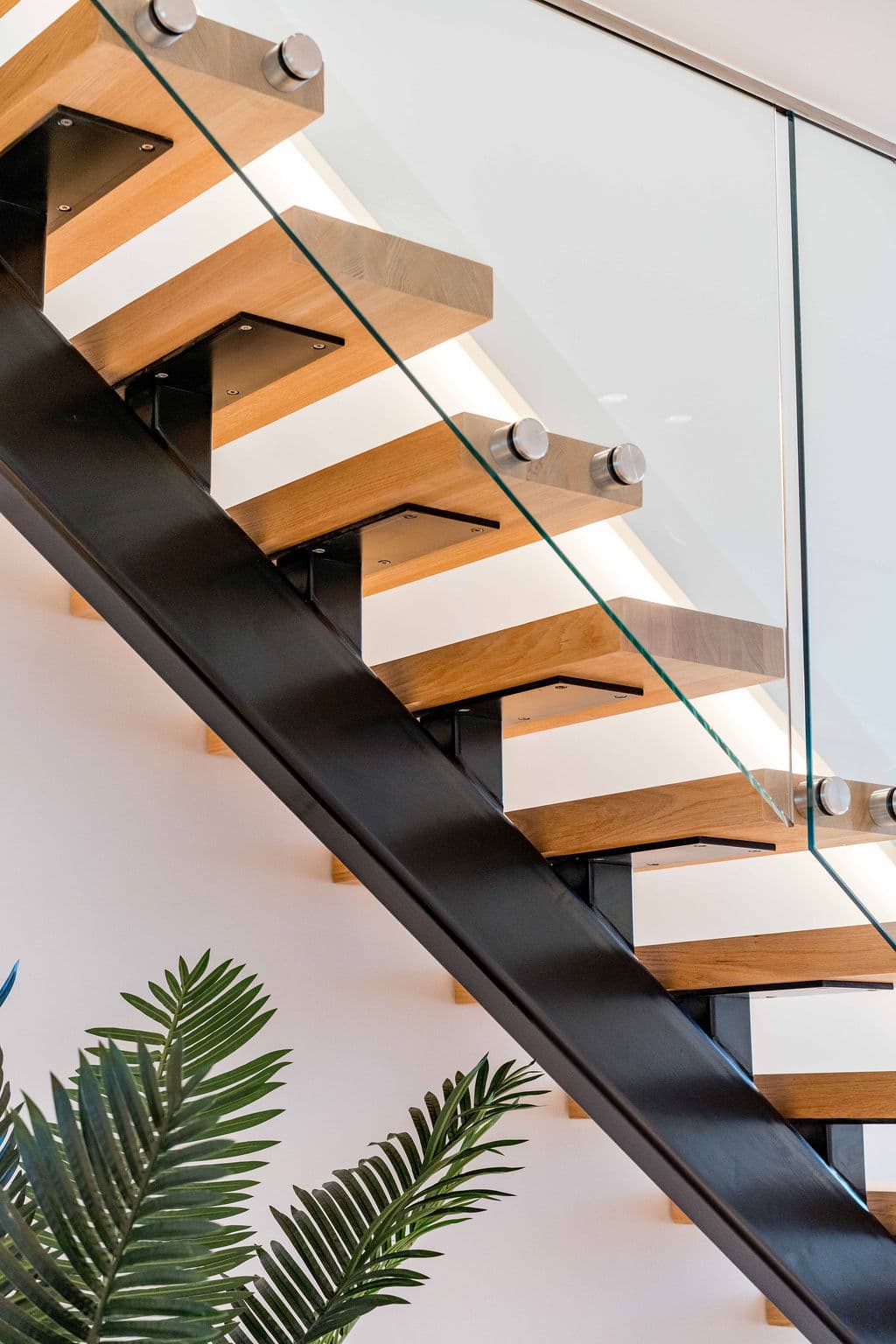 Cronulla project — floating staircase with oak treads and glass balustrade, view