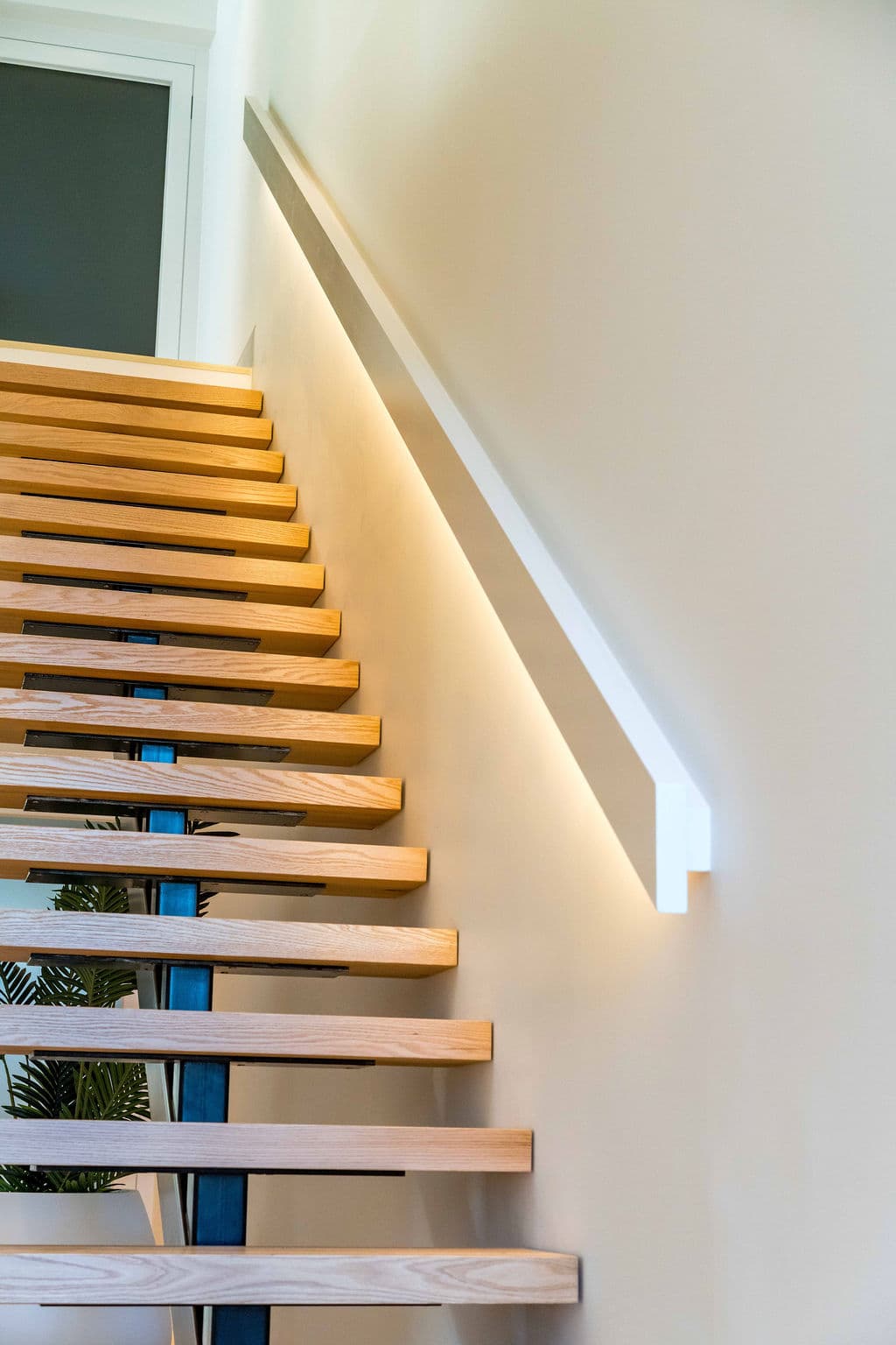 Cronulla project — floating staircase with oak treads and glass balustrade, view