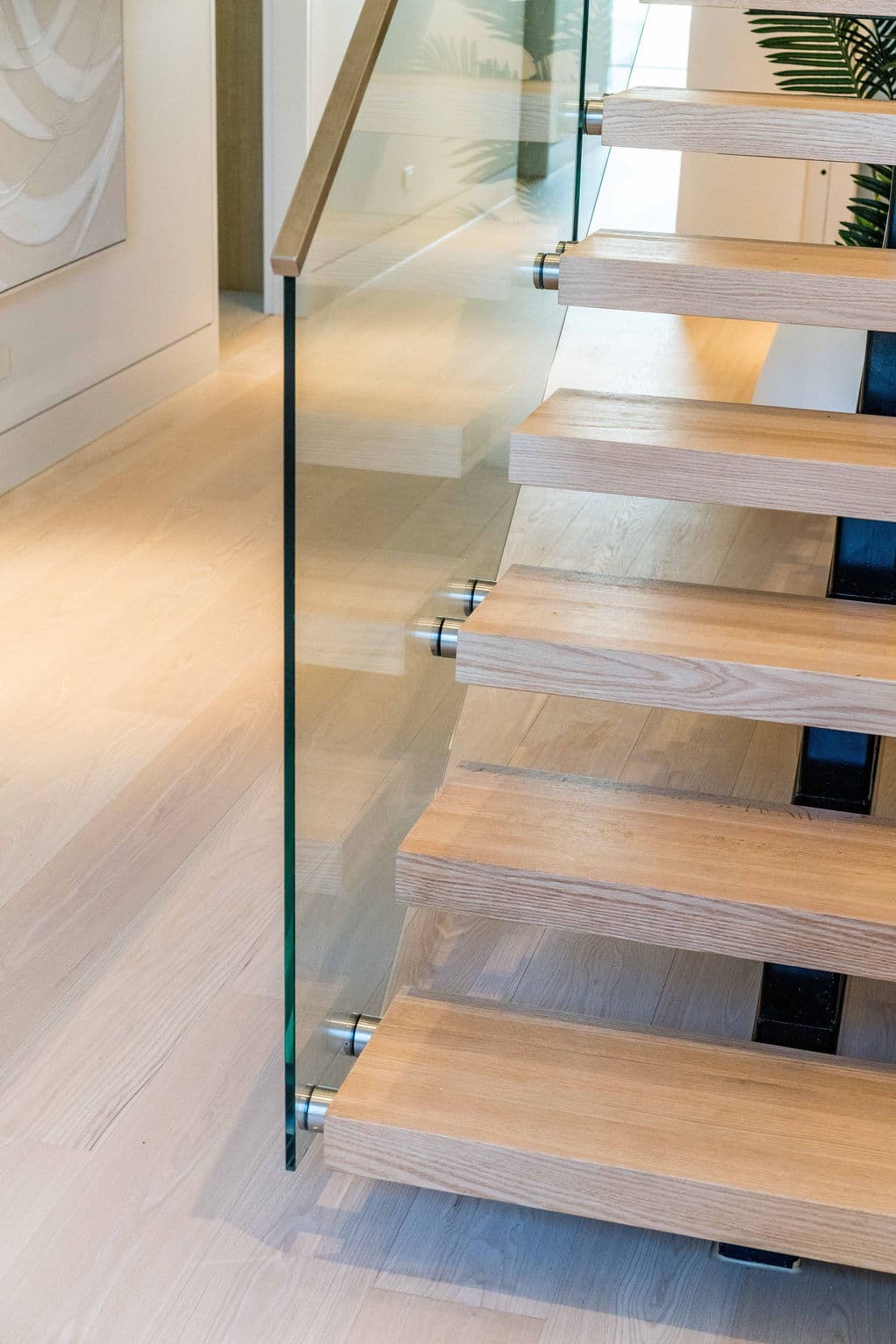 Cronulla project — floating staircase with oak treads and glass balustrade, view