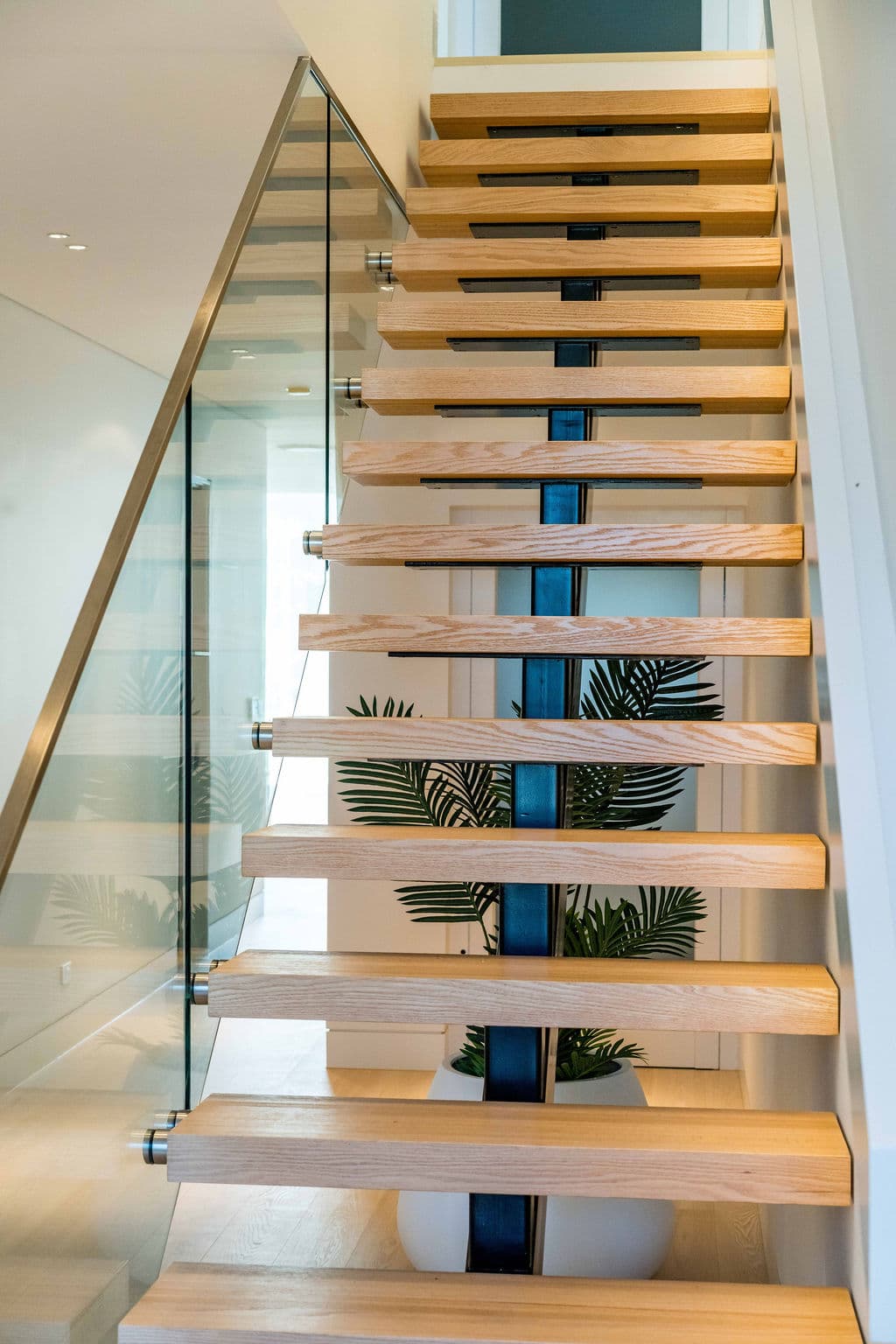 Cronulla project — floating staircase with oak treads and glass balustrade, view