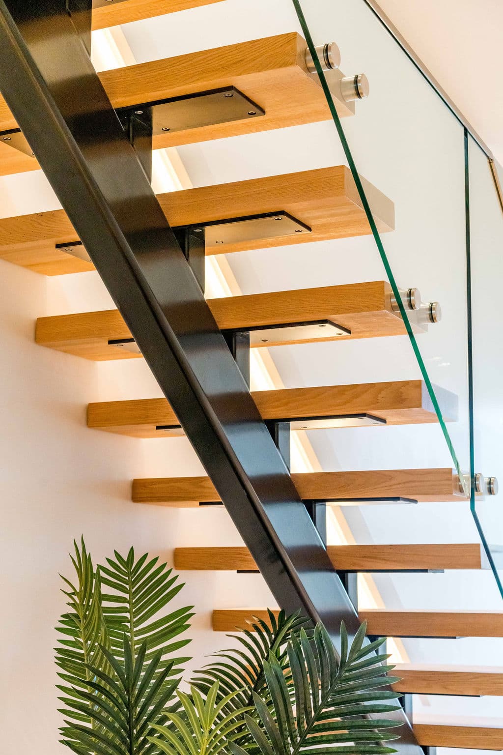 Cronulla project — floating staircase with oak treads and glass balustrade, view