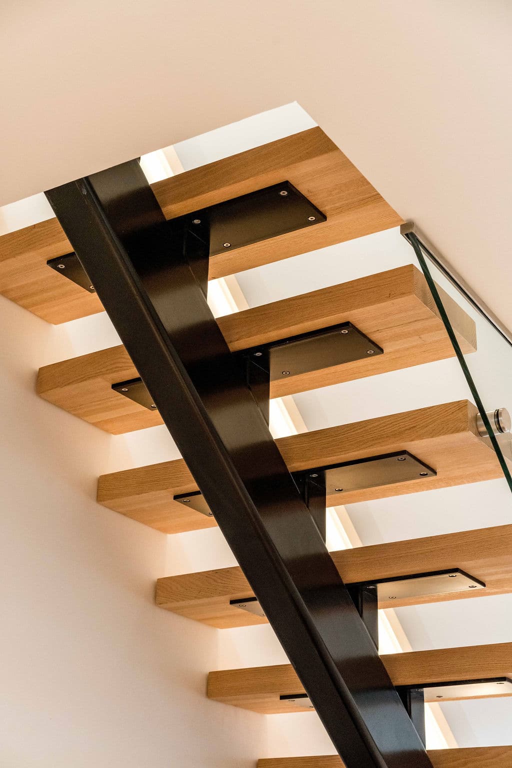 Cronulla project — floating staircase with oak treads and glass balustrade, view
