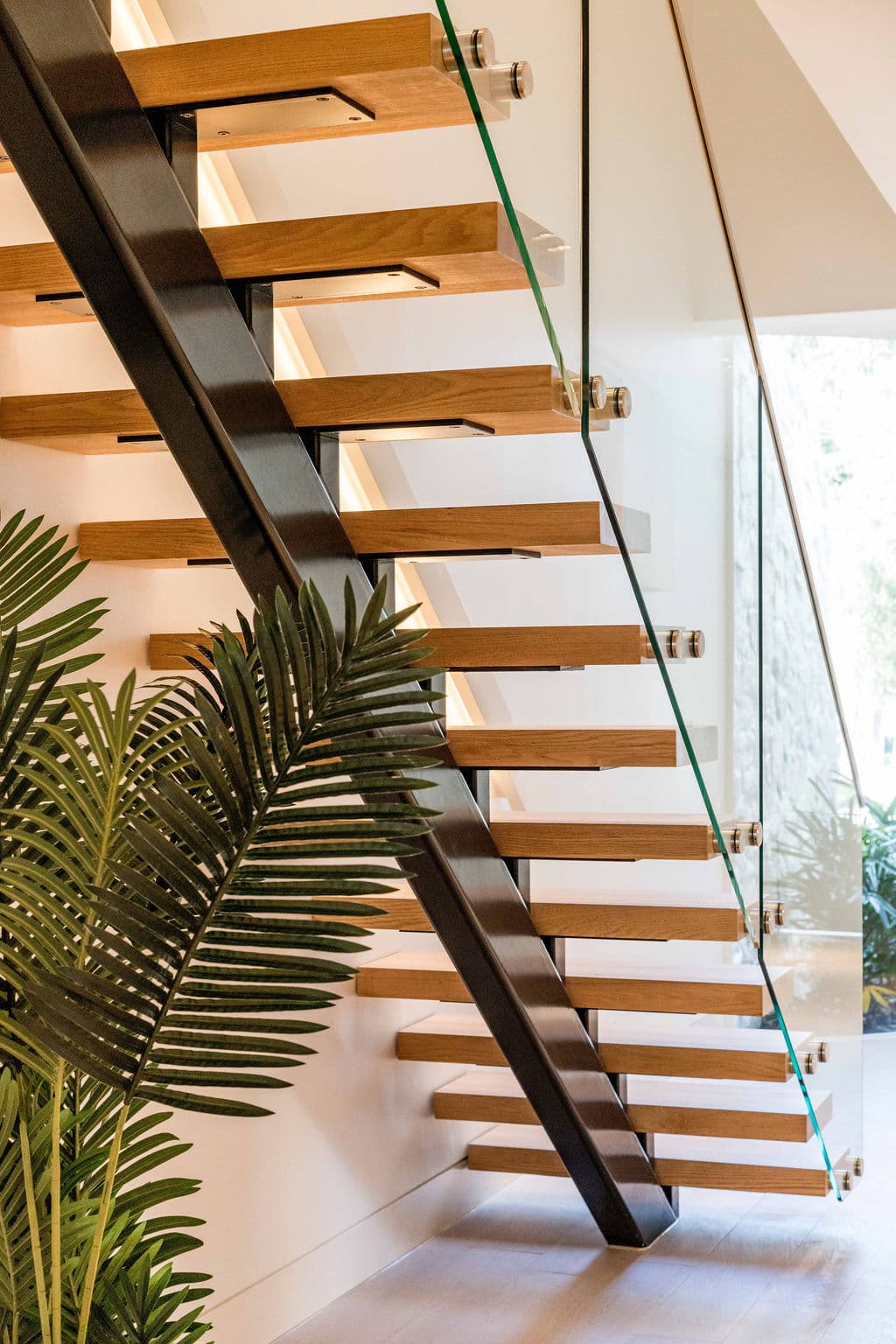 Cronulla project — floating staircase with oak treads and glass balustrade, view