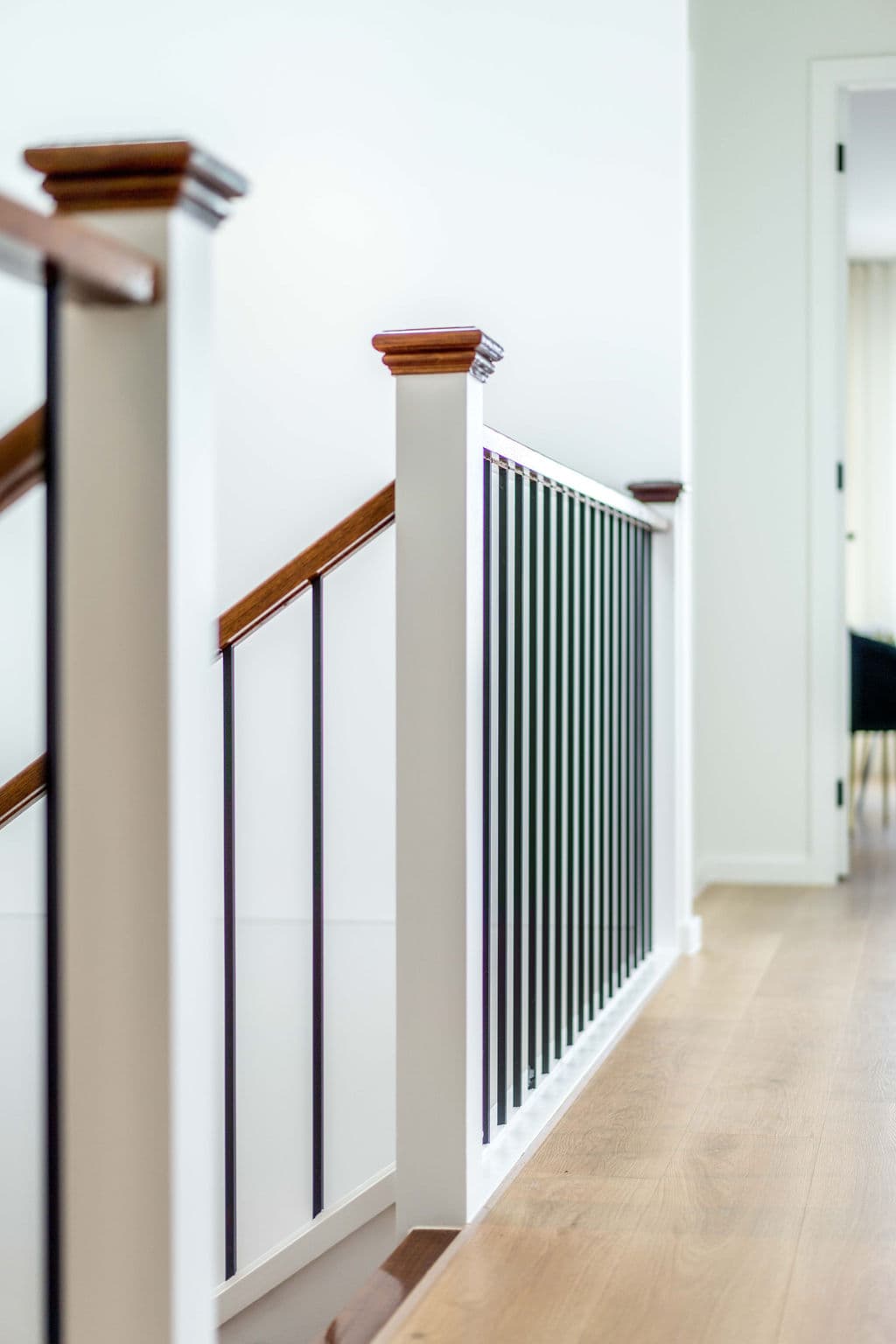 Wilton project — traditional staircase with timber treads and iron spindle balustrade, craftsmanship detail