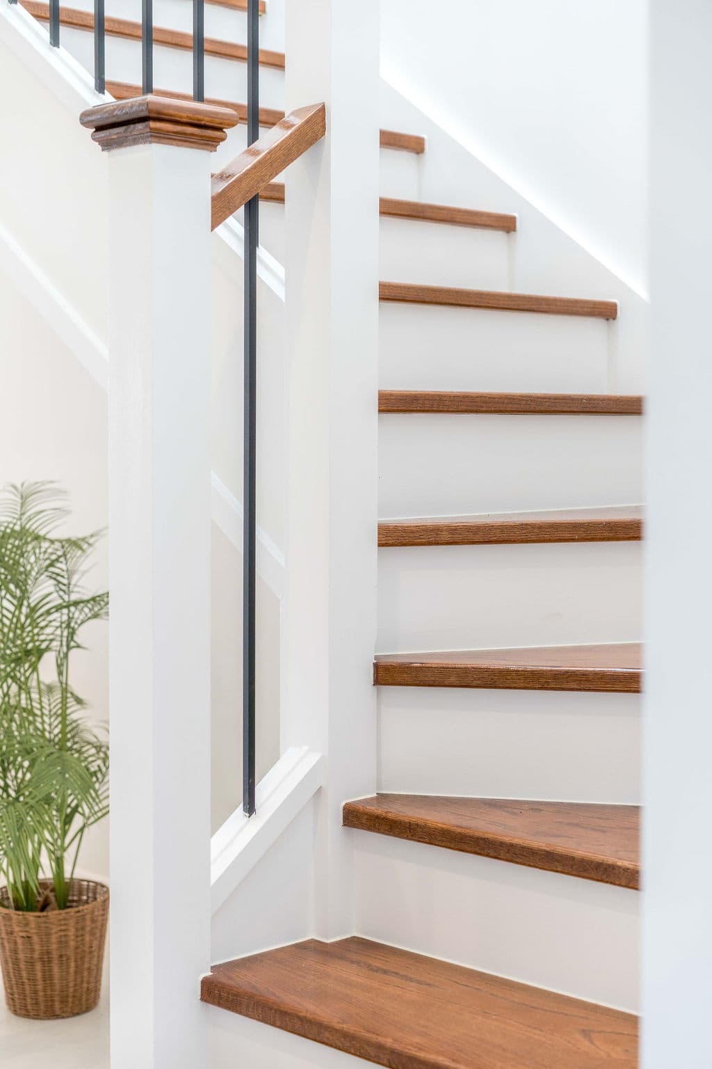Wilton project — traditional staircase with timber treads and iron spindle balustrade, craftsmanship detail
