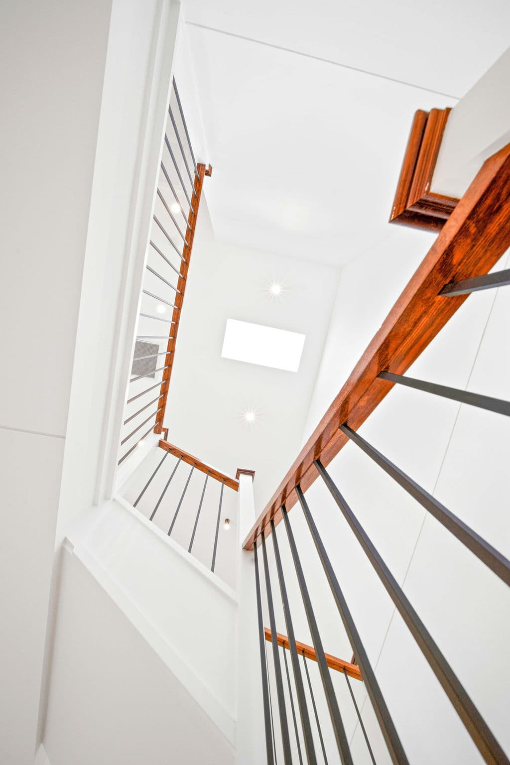 Wilton project — traditional staircase with timber treads and iron spindle balustrade, wide view