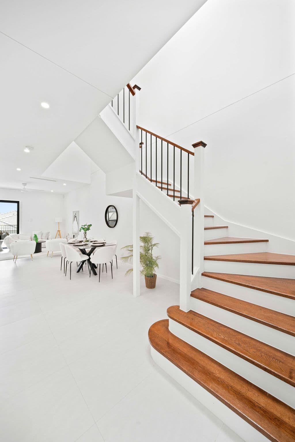 Wilton project — traditional staircase with timber treads and iron spindle balustrade, wide view