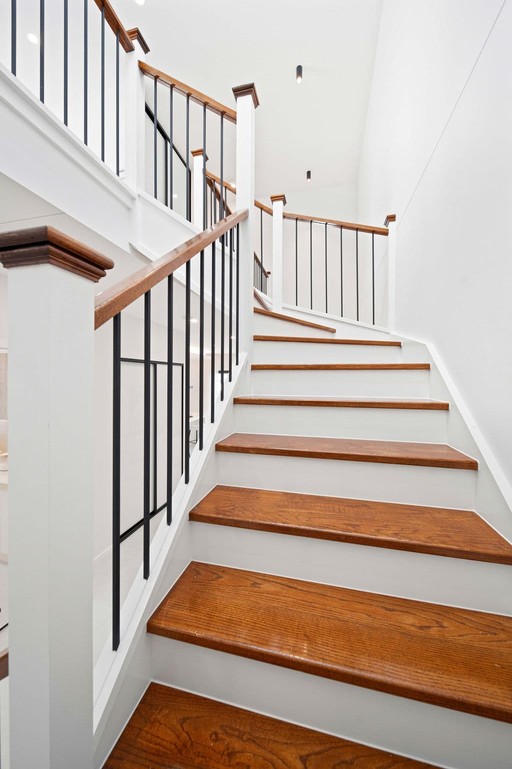 Wilton project — traditional staircase with timber treads and iron spindle balustrade, wide view
